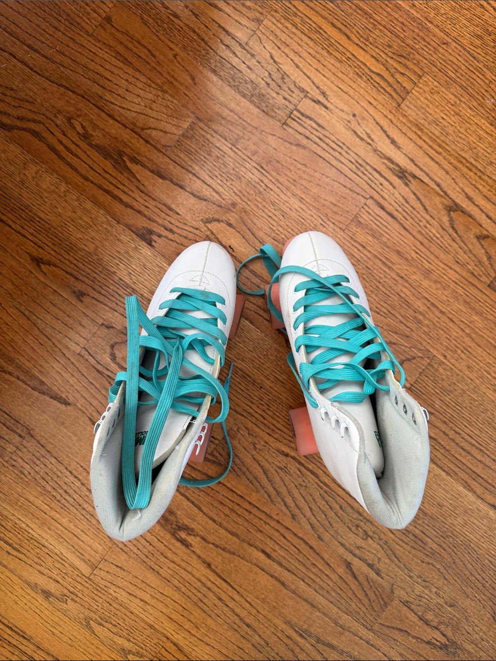 White Roller Skates with Teal Laces and Coral Wheels